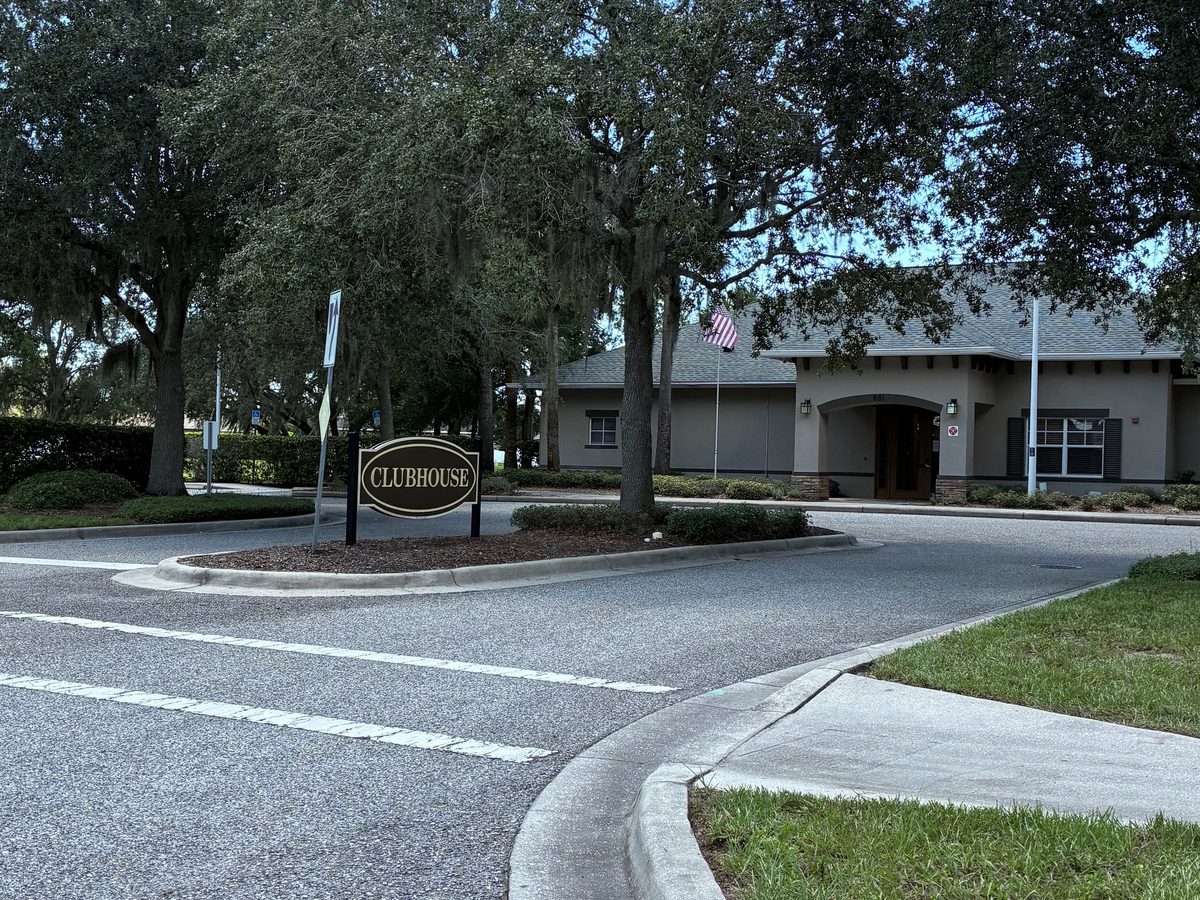 Tree-lined drive leading to the Avalon clubhouse