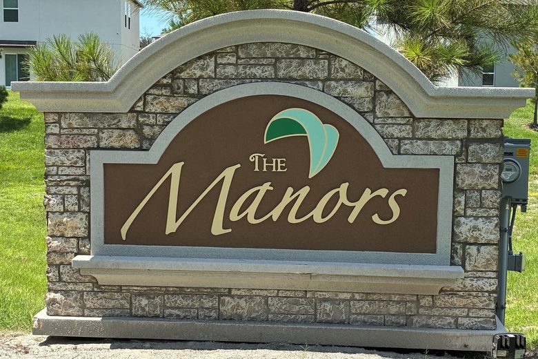The Manors entrance sign